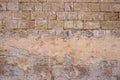 Limestone, sandstone brown, grey background. Aged, peeled, vintage, empty wall for backdrop. Close up view with details.