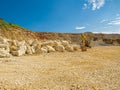 Limestone Stone Quary and an excavator. Royalty Free Stock Photo