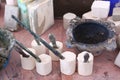 limestone work pieces for sculpturing with brushes and paint closeup photo