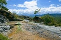 Limestones at Songwe Hot Springs against a Mountain background in Mbeya, Tanzania