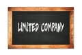 LIMITED COMPANY text written on wooden frame school blackboard