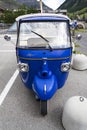 Limited edition model of three-wheeled vehicle Piaggio Ape Calessino stands on street on 1 August 2016 in Livigno, Italy.