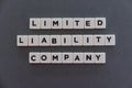 Limited liability company (LLC) word made of square letter word on grey background Royalty Free Stock Photo