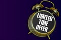 Limited time offer yellow alarm clock on purple background Royalty Free Stock Photo