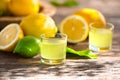 Limoncello, Italian liqueur with lemons. Traditional Mediterranean sweet shot alcoholic drink close up