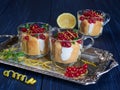 Limoncello or limoncino tiramisu topped with redcurrants and mint leaves