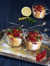 Limoncello or limoncino tiramisu topped with redcurrants and mint leaves