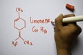 Limonene C10,H16 molecule written on the white board. Structural chemical formula. Education concept Royalty Free Stock Photo