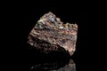 Limonite or brown iron ore, raw rock on black background, mining and geology