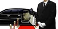 Limousine chauffeur standing by the car Royalty Free Stock Photo