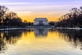 Historic Lincoln Memorial and Reflecting Pool at Sunset in Washington DC, USA. Beautiful Sky Colors. Bare Trees Across the Park Royalty Free Stock Photo