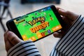 Lincoln, United Kingdom - 06/30/2018: Someone playing pokemon quest, the new game for mobile.