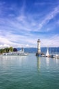 Ship sails away from picturesque port town Lindau on Lake Constance.. Vertical view