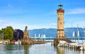 Lindau, Germany. Old lighthouse with clock in the bay Royalty Free Stock Photo