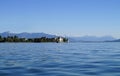 Lindau island on lake Constance (Bodensee) with snowy Swiss Alps in background, Germany on fine sunny spring day