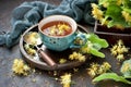 Linden flowers and cup of healthy tea, herbal medicine Royalty Free Stock Photo