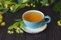 Linden herbal tea on wooden background Royalty Free Stock Photo