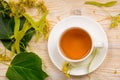 Linden herbal tea on wooden table Royalty Free Stock Photo