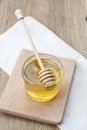 Linden honey in jar and calendula blossoms on wooden table Royalty Free Stock Photo