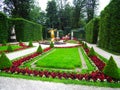 Linderhof, Germany - July 7, 2015: Courtyard with Linderhof Castle in Bavaria. Beautiful statues and flower beds in the park.