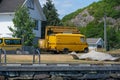 Large yellow vintage van with an inspection crane..