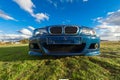 Wideangle view of the front of a blue BMW M3 E46..