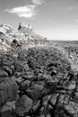 Lindisfarne Castle and beach (black and white) III Royalty Free Stock Photo