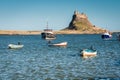 Lindisfarne Castle with boats Royalty Free Stock Photo