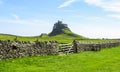 Lindisfarne Castle panoramic view, rock fence and wooden gate, Holy Island, Northumberland