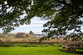 Lindisfarne Castle seen from the grounds of Lindisfarne Priory on Holy Island, Northumberland, UK Royalty Free Stock Photo