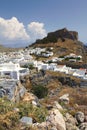 Lindos with the castle above on the Greek Island of Rhodes. Rhodes island - famous for historic landmarks and beautiful beaches Royalty Free Stock Photo