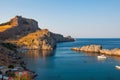 Lindos, Greece - August 11, 2018: Cove with acropolis located on a rock, Lindos city at sunset, Greece Royalty Free Stock Photo