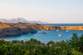 Lindos, Greece - August 11, 2018: Cove with acropolis located on a rock, Lindos city at sunset, Greece Royalty Free Stock Photo