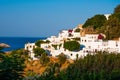 Lindos, Greece - August 11, 2018: Landscape of the white houses of the city of Lindos at sunset, Greece