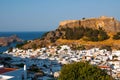 Lindos, Greece - August 11, 2018: Landscape of the white houses of the city of Lindos at sunset, Greece