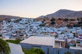 Lindos, Greece - August 11, 2018: Landscape of the white houses of the city of Lindos at sunset, Greece Royalty Free Stock Photo