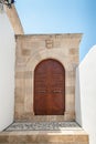 Lindos, Greece. 05/29/2018. Traditional door to household in Lindos Town. Greek Island of Rhodes. Europe Royalty Free Stock Photo