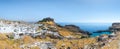 Lindos, with its ancient acropolis, ruins fortress and closed bays in sea coast, is the most view place of Rhodes island in Royalty Free Stock Photo