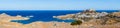 Lindos, with its ancient acropolis, ruins fortress and closed bays in sea coast, is the most view place of Rhodes island in Royalty Free Stock Photo