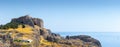 Lindos, with its ancient acropolis, ruins fortress and closed bays in sea coast, is the most view place of Rhodes island in Royalty Free Stock Photo