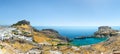 Lindos, with its ancient acropolis, ruins fortress and closed bays in sea coast, is the most view place of Rhodes island in Royalty Free Stock Photo