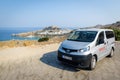 Rental Nissan Evalia is staying parked near Lindos town on Rhodes town, Greece