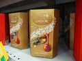 Lindt Lindor assorted chocolate in the golden box on the supermarket shelf.