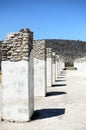 A line of ancient pillars and shadows from them