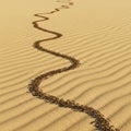 A line of ants traverses a sandy desert, moving in a sinuous, wavy path across the sof Royalty Free Stock Photo