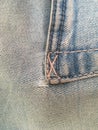 A line on a back pocket. Vintage blue jeans.