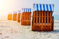 Line of beach Chairs on sandy beach on Travemuende, Luebeck Bay, Germany