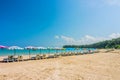 Line of beach umbrellas and sunbathe seats on Phuket sand beach Royalty Free Stock Photo