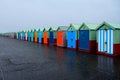 A line of 40 beaches with multicolored doors vanishing perspective Royalty Free Stock Photo