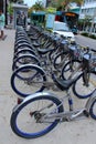 Line of bicycles used for transportation on busy street in Miami Florida,Springtime,2013
